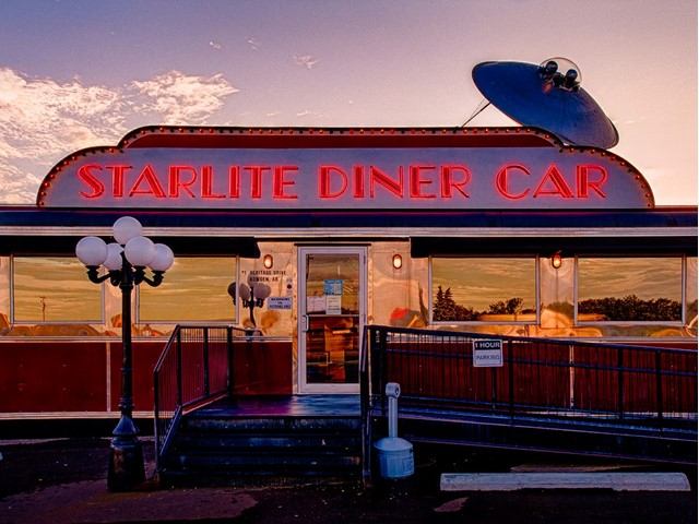 Exterior of the Starlite Diner car at dusk.