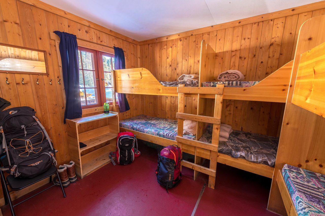 Cozy guest room with bunkbeds.