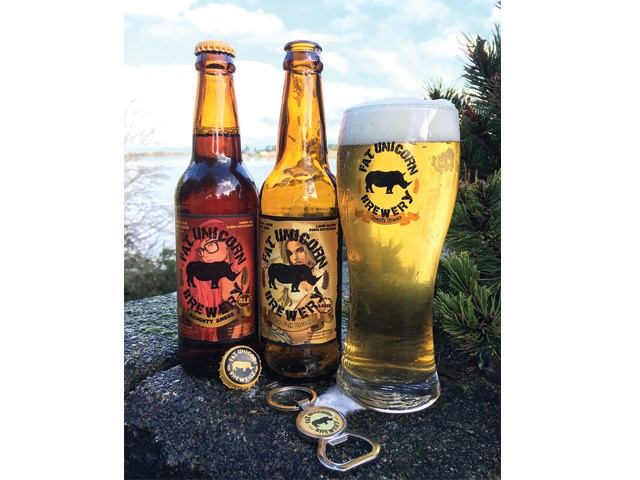 Two bottles of their brew and a glass of brew.