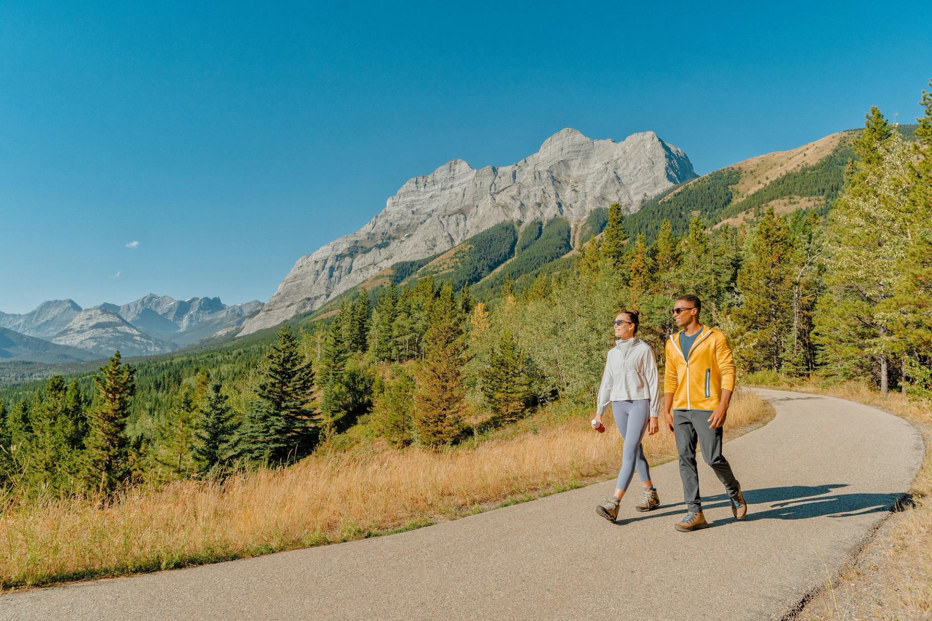 A couple walking along the Upper Kananaskis Lake Trail.
