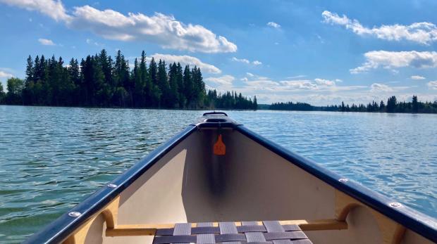 Tip of canoe on Astotin Lake in Elk Island National Park.