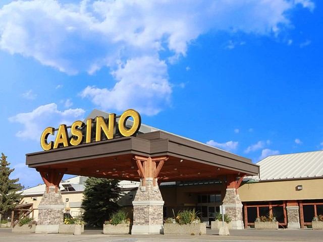 Exterior view of Century Casino with large sign and blue sky backdrop