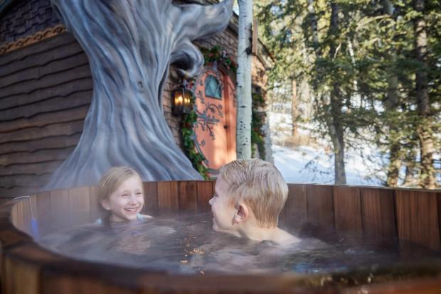 Kids enjoying the hot tub at Charmed family resort.