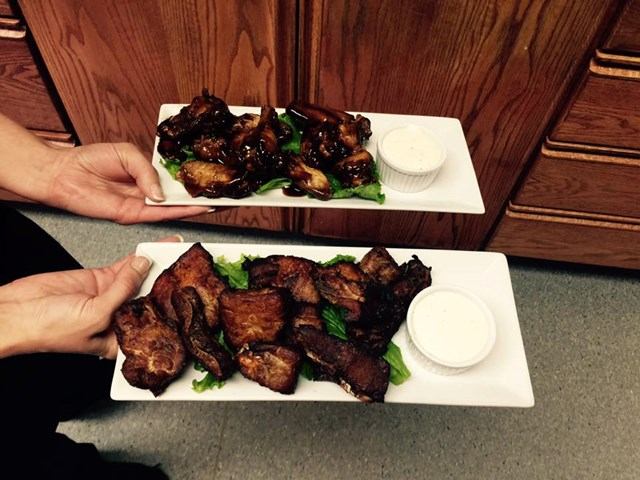 Grilled meat on lettuce with dipping sauce at Piccolos Pizza & Pasta.