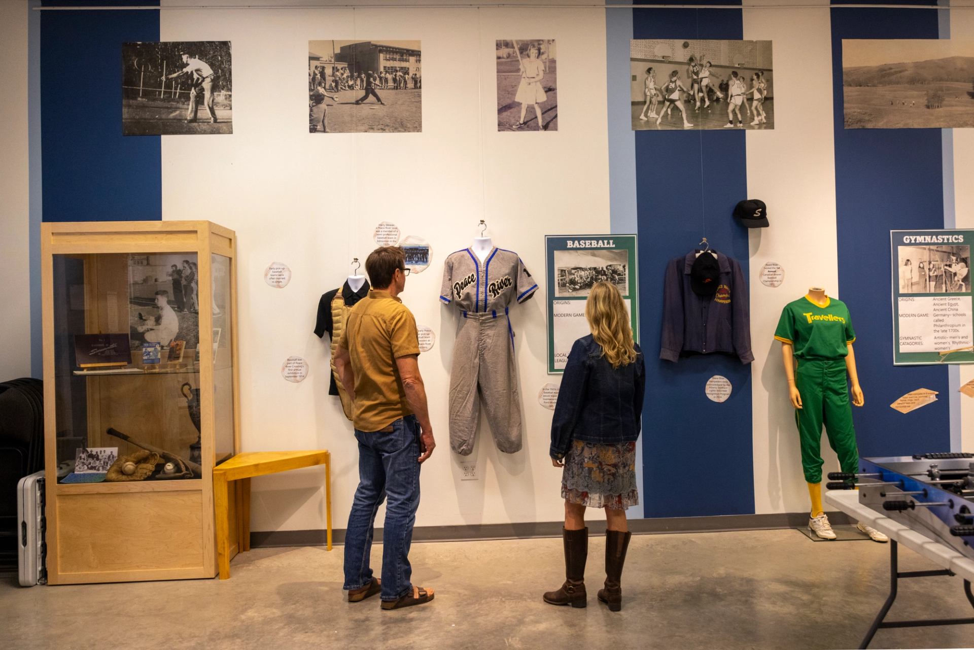 A couple look at an exhibit in the Peace River Museum Archives and Mackenzie Centre.