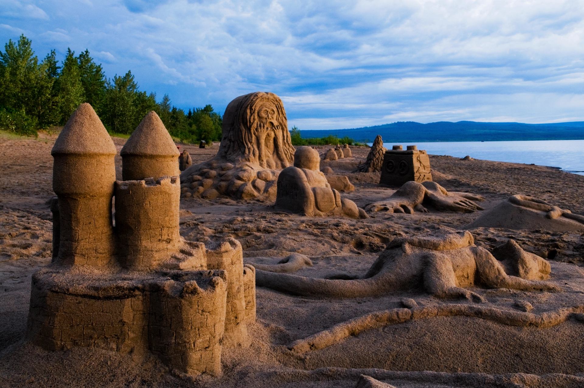 Sand castle structures on the beach.