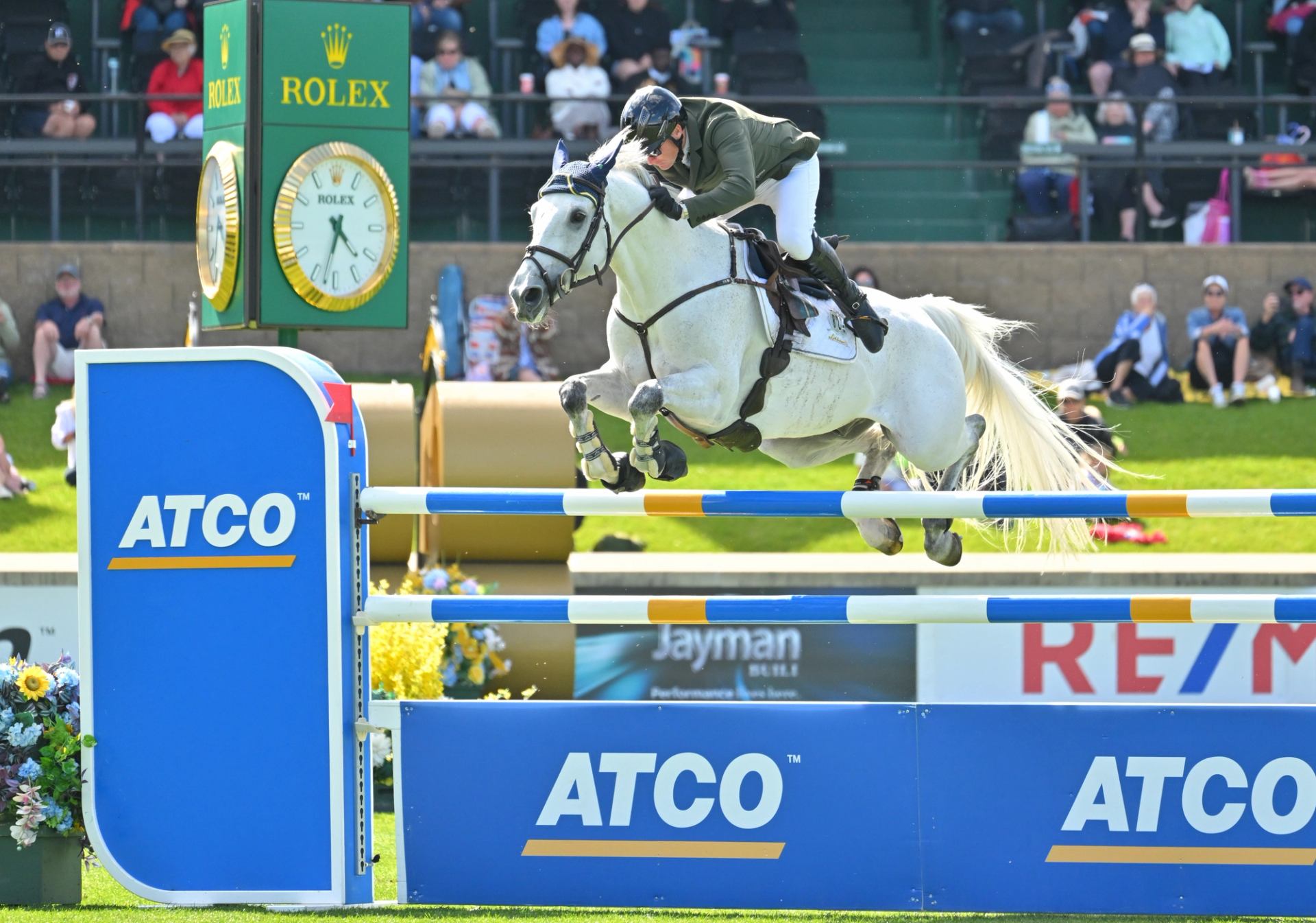 A rider and horse clear a jump during the North American Tournament presented by Rolex.