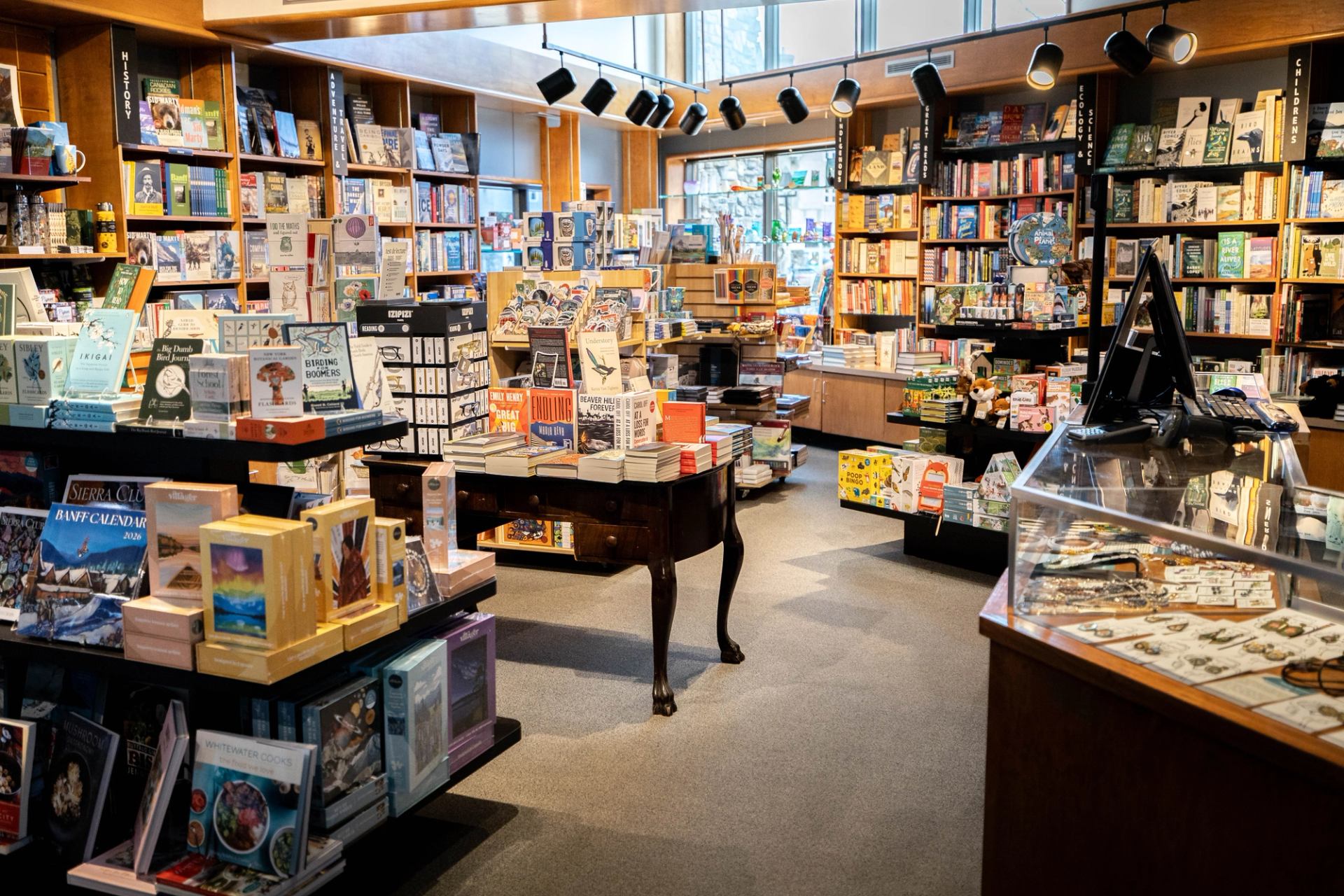 Interior of a museum shop filled with books, displays, and local gifts.