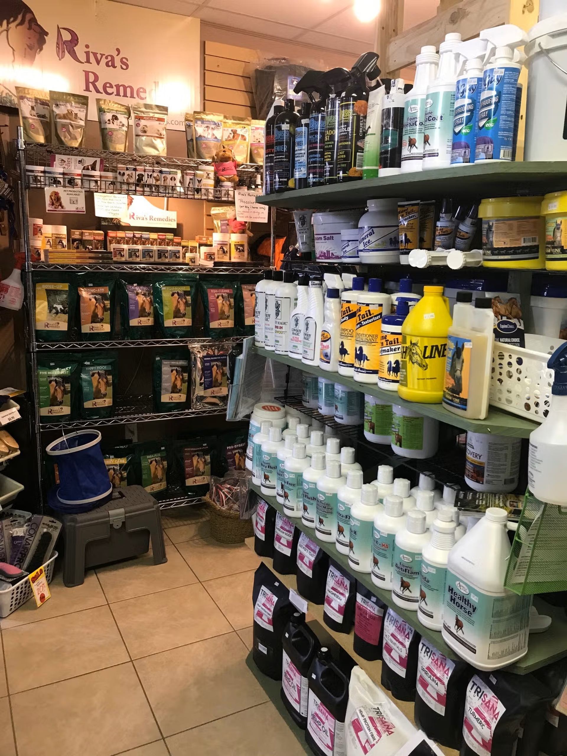 Shelves stocked with pet cleaning products and supplies inside Chinook Windz store.