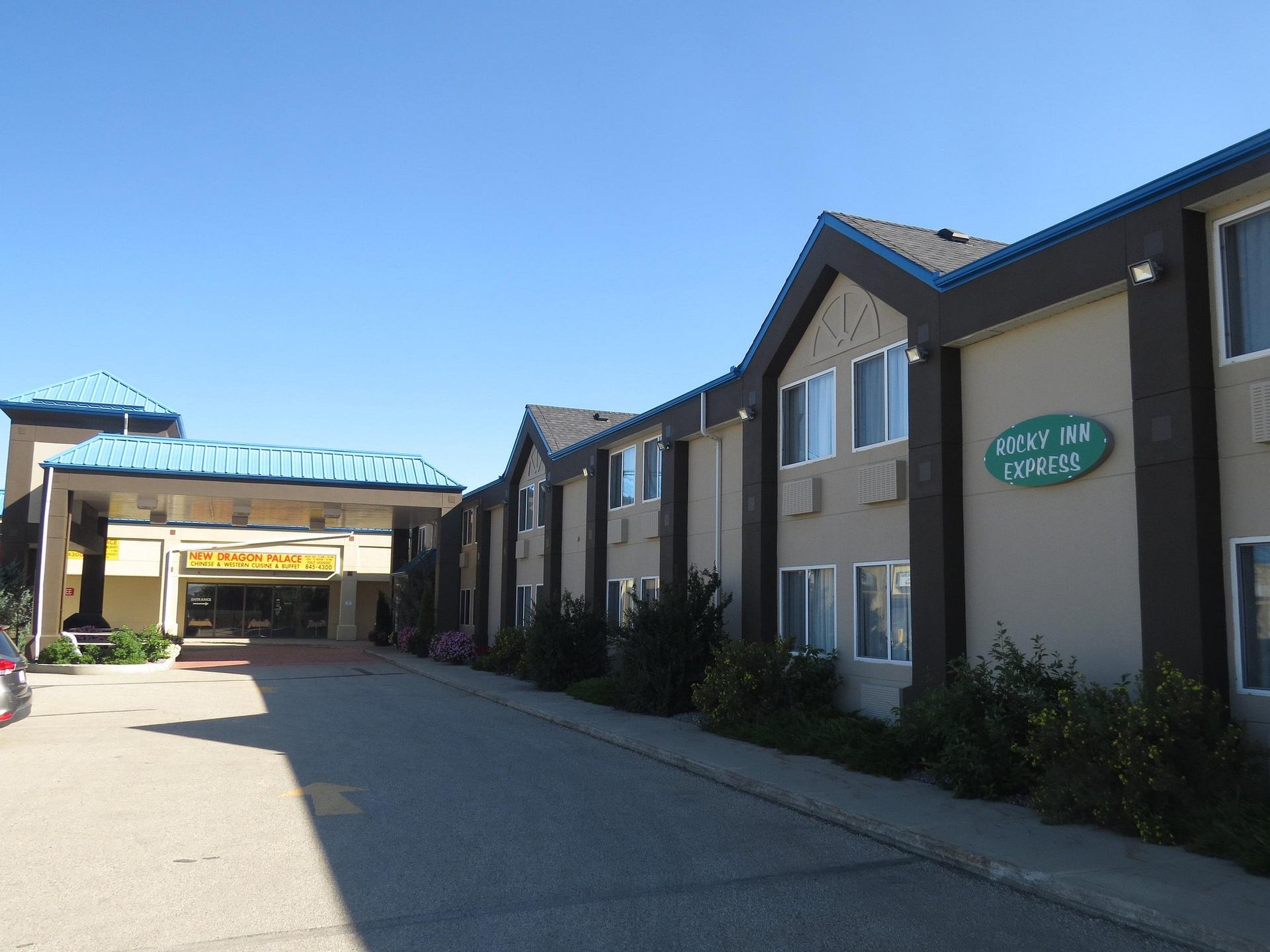 Rocky Inn Express exterior beside a covered entrance and paved driveway.