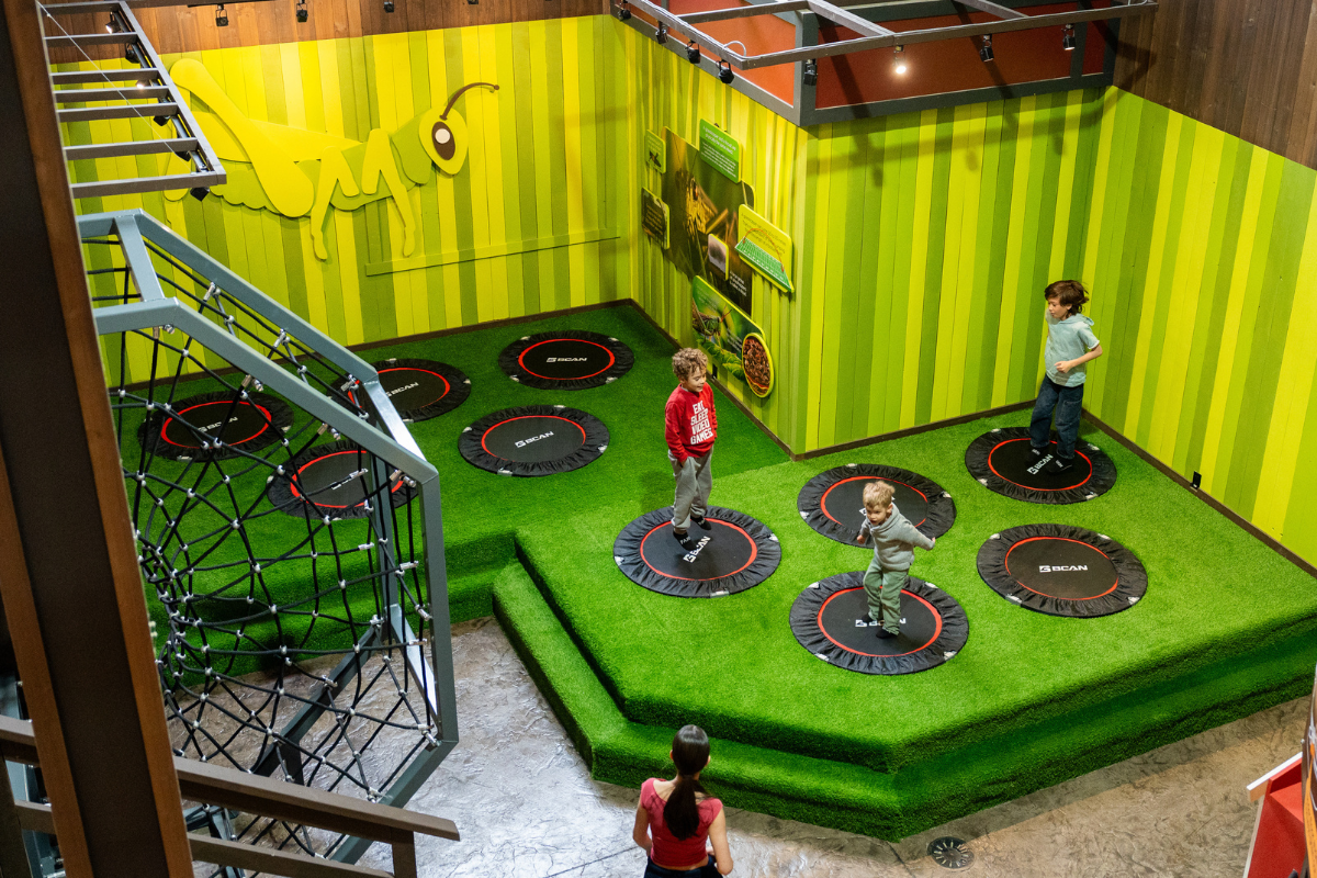 Kids jumping on trampolines in a bright indoor play area at Granary Road.