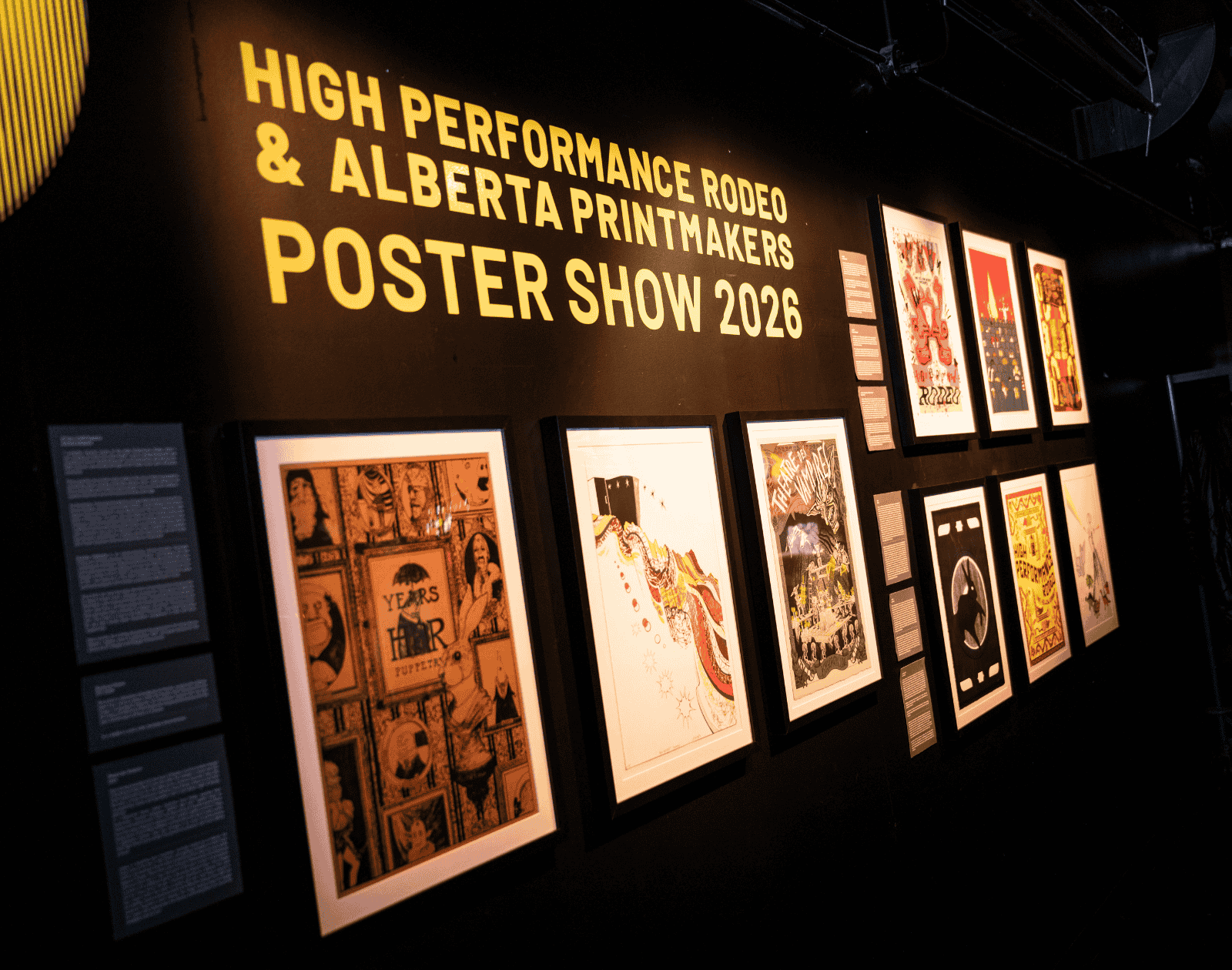 Framed posters on display in the Laycraft Lounge as part of the High Performance Rodeo.