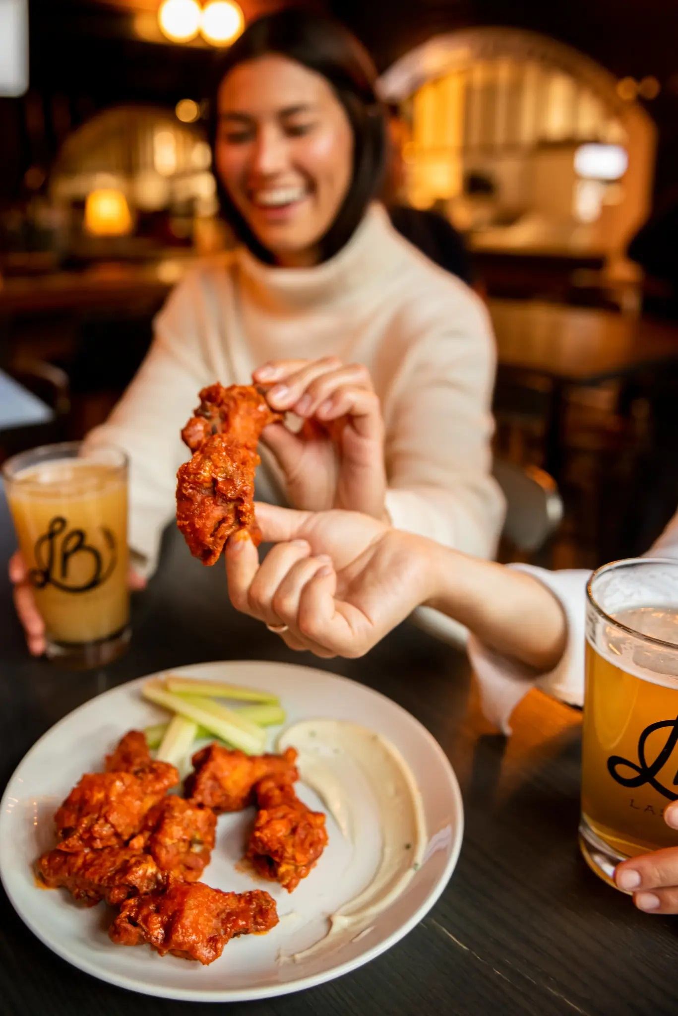 People enjoying food and beers.