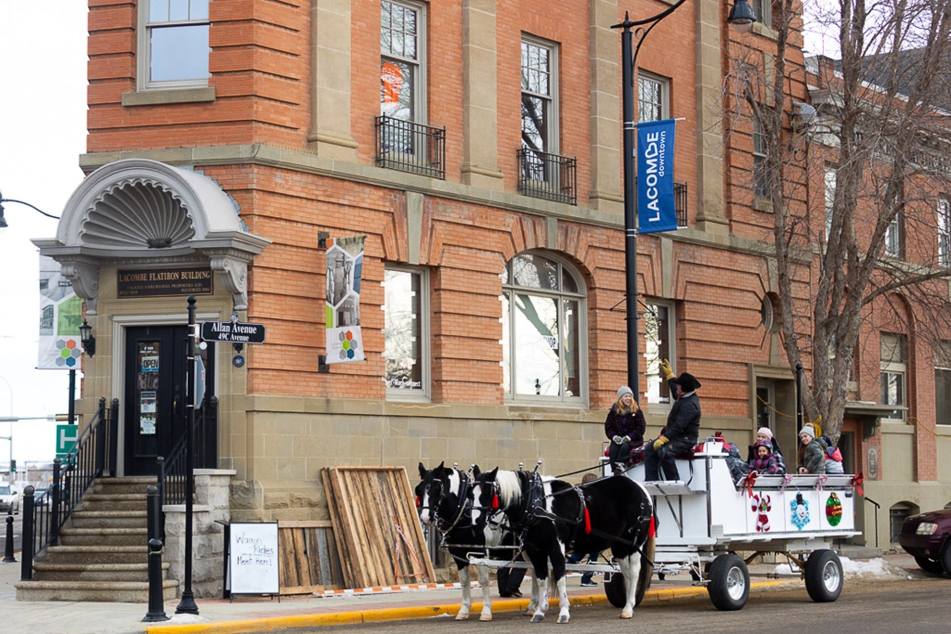 Exterior of Flat Iron Museum with a horse and carriage outside.