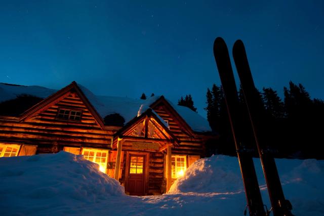 Exterior of Skoki Lodge at night, in the Summer.