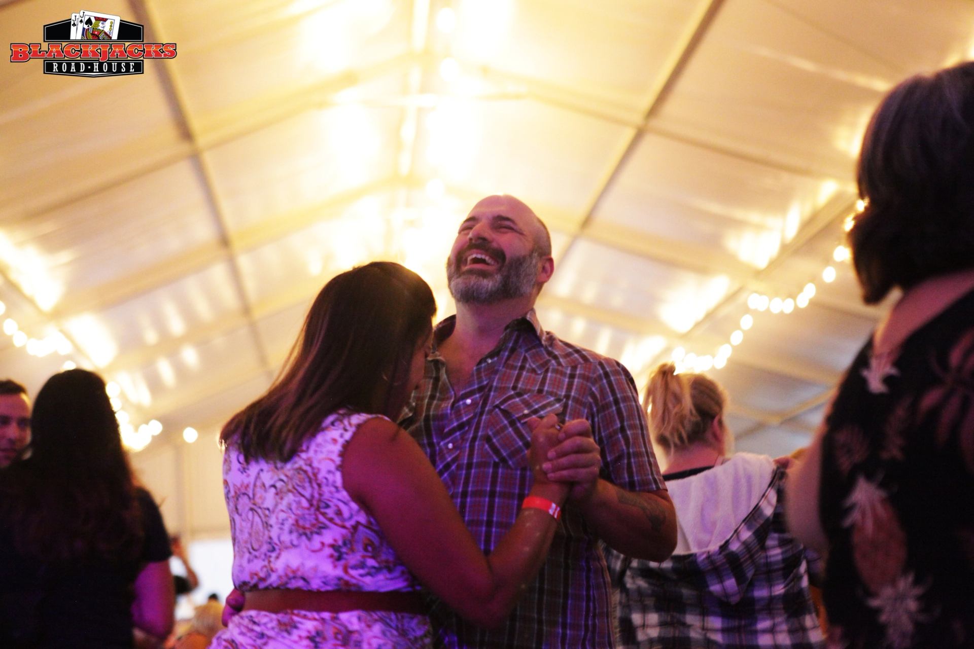 People dancing at the event.