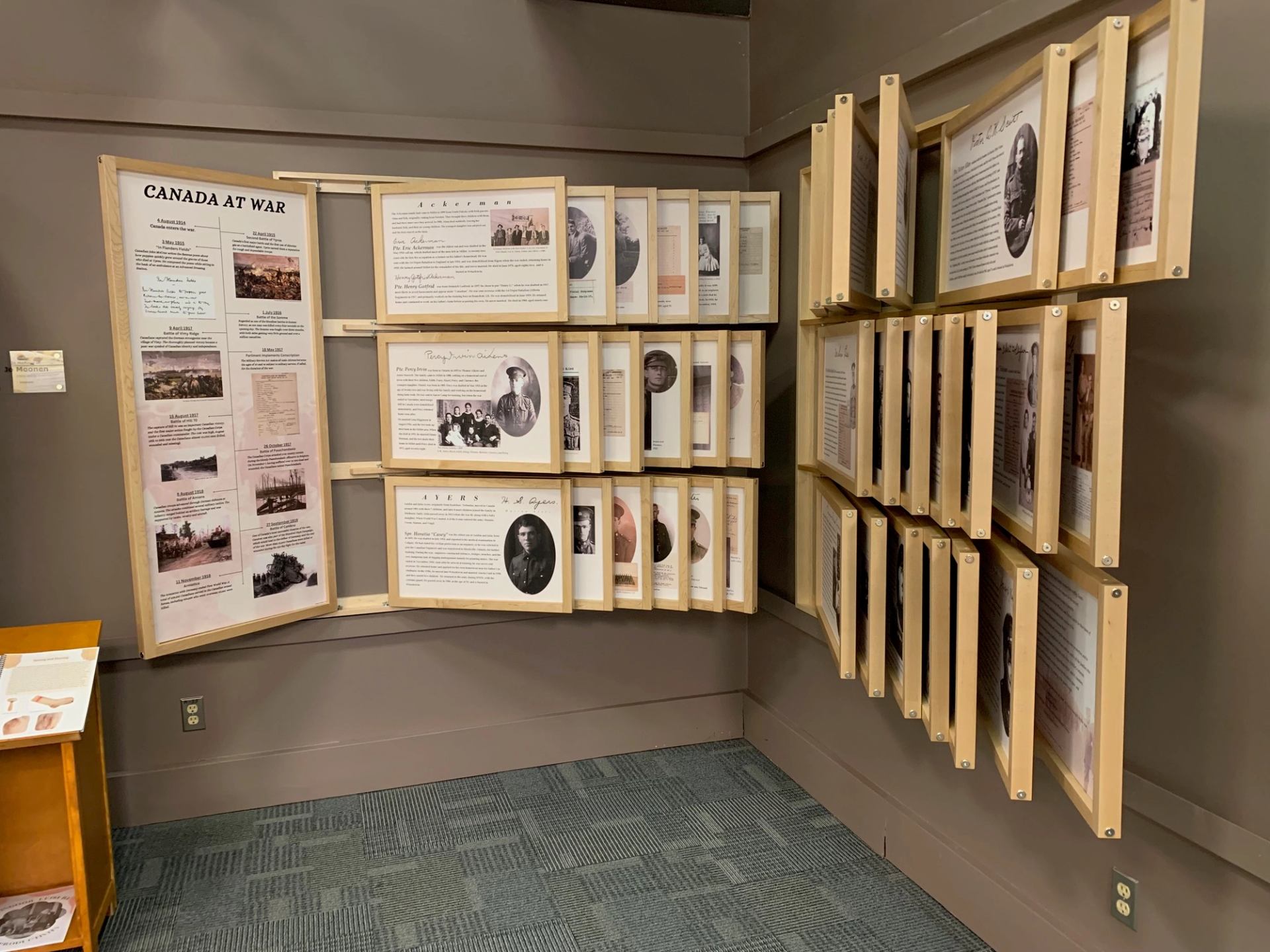 Interactive display panels at Millet Museum showcasing historical photos and stories.