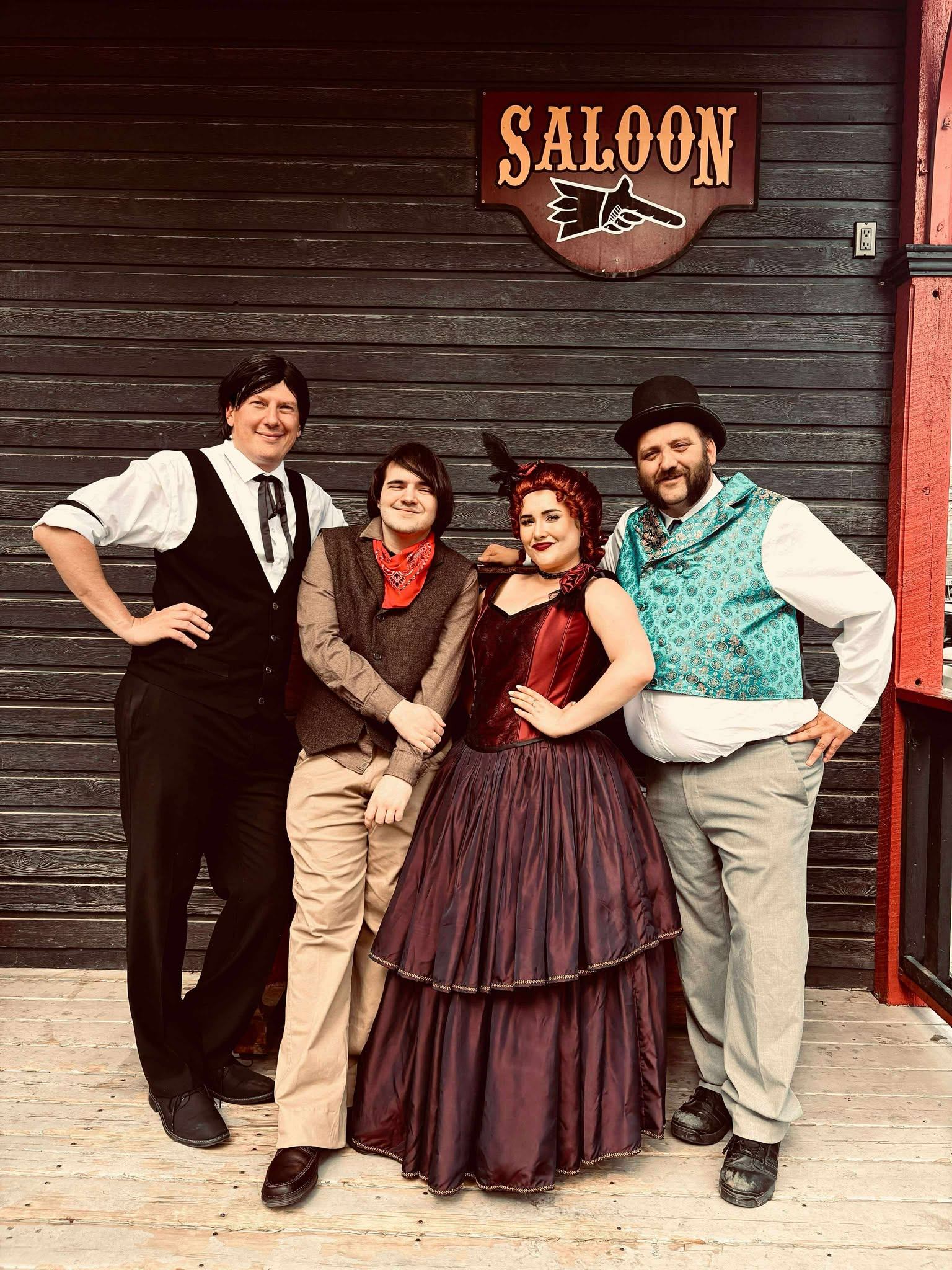 Cast dressed in historical western costumes.