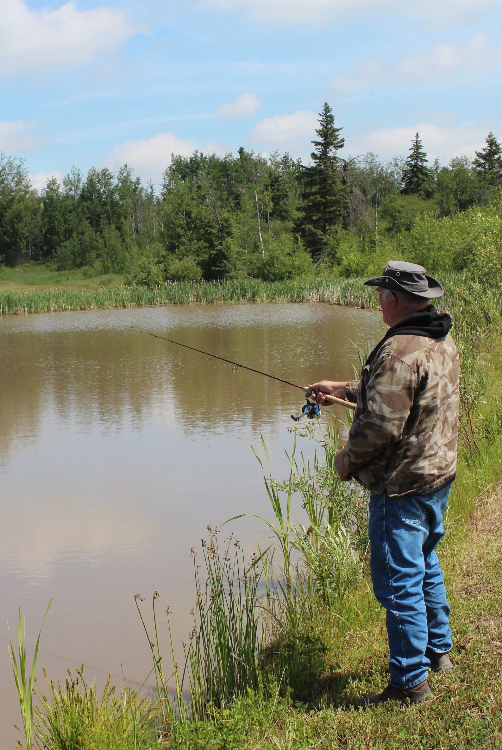 A man fishing from the shore.