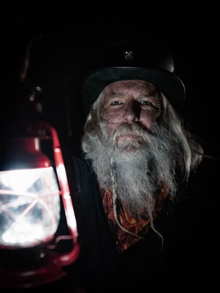 The guide holding a red lantern.