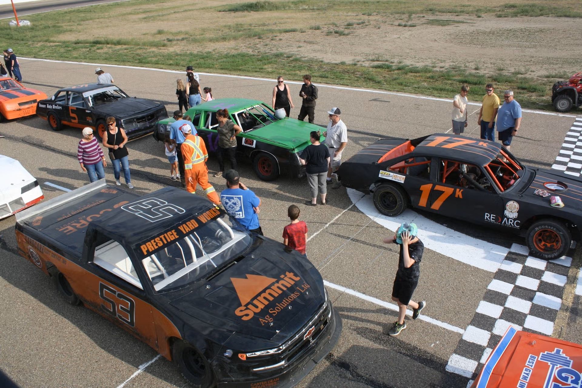 Cars lined up ready to race.
