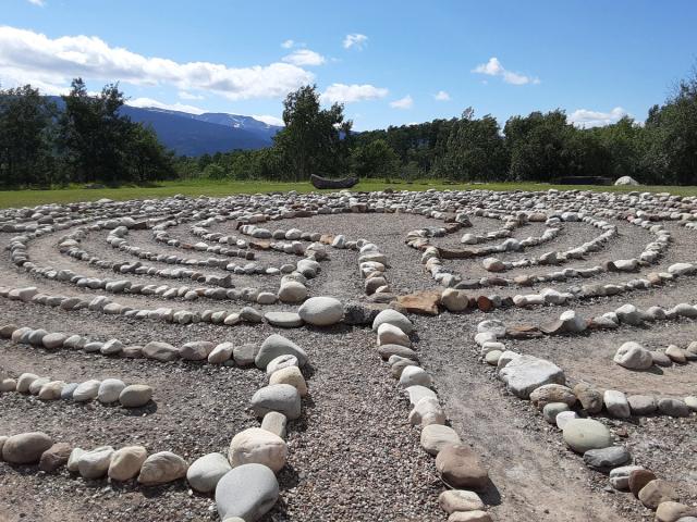 A winding path through the labyrinth, creating a serene and inviting atmosphere.