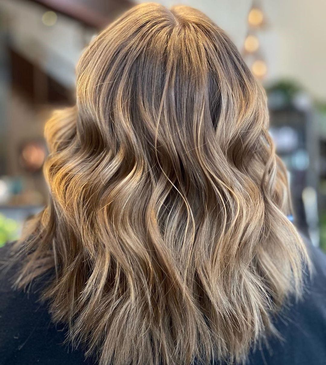Back view of shoulder-length hair with smooth, natural-looking waves.