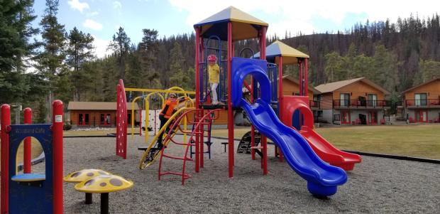 Childern playing on the playground at Becker's Chalets.