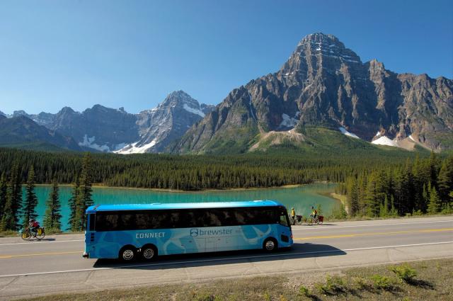 Bus driving along the Icefields Parkway Highway in Jasper National Park.