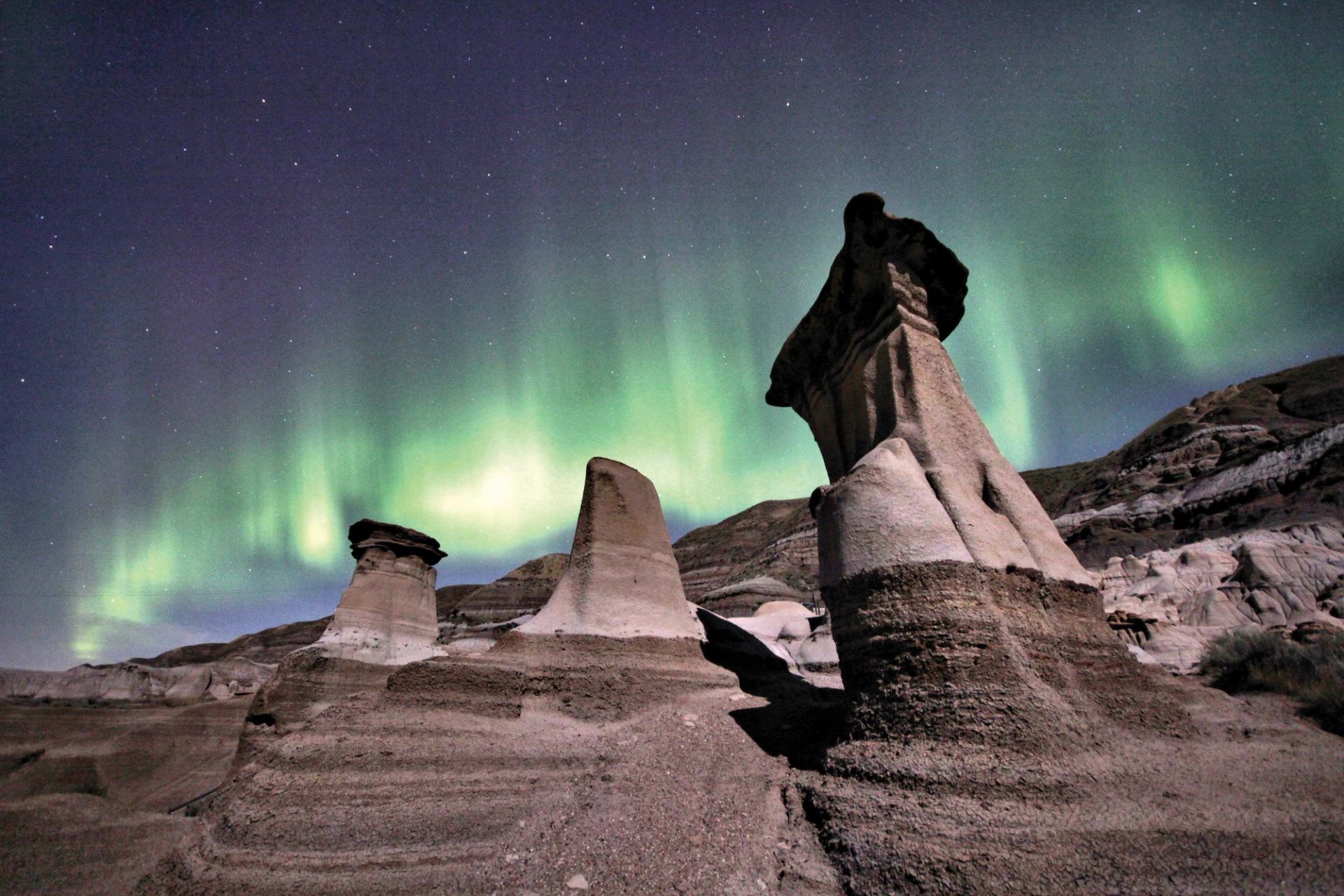 Northern lights behind the Hoodoos in Drumheller.