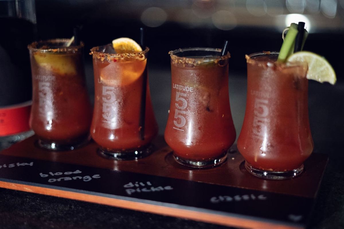 Four Caesar cocktails in a tasting flight at Latitude 55 Distillery & Lounge.
