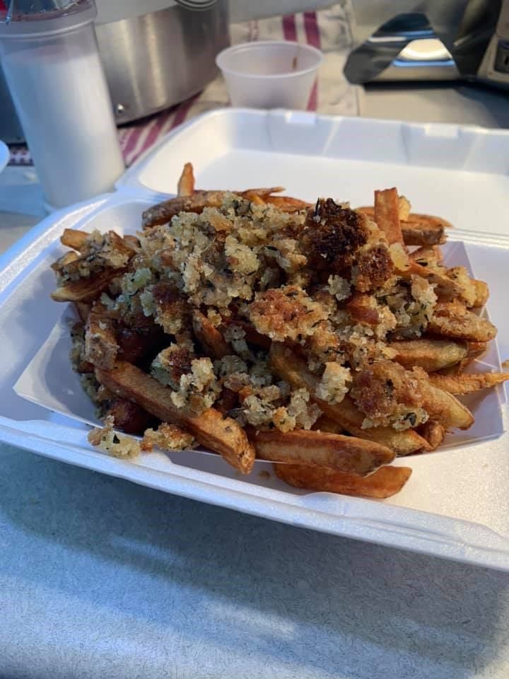 Food counter with fries and toppings at Fry Factory.