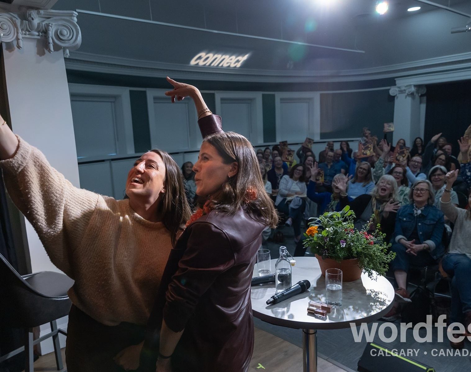 Authors take a selfie with cheering Wordfest audience in Calgary