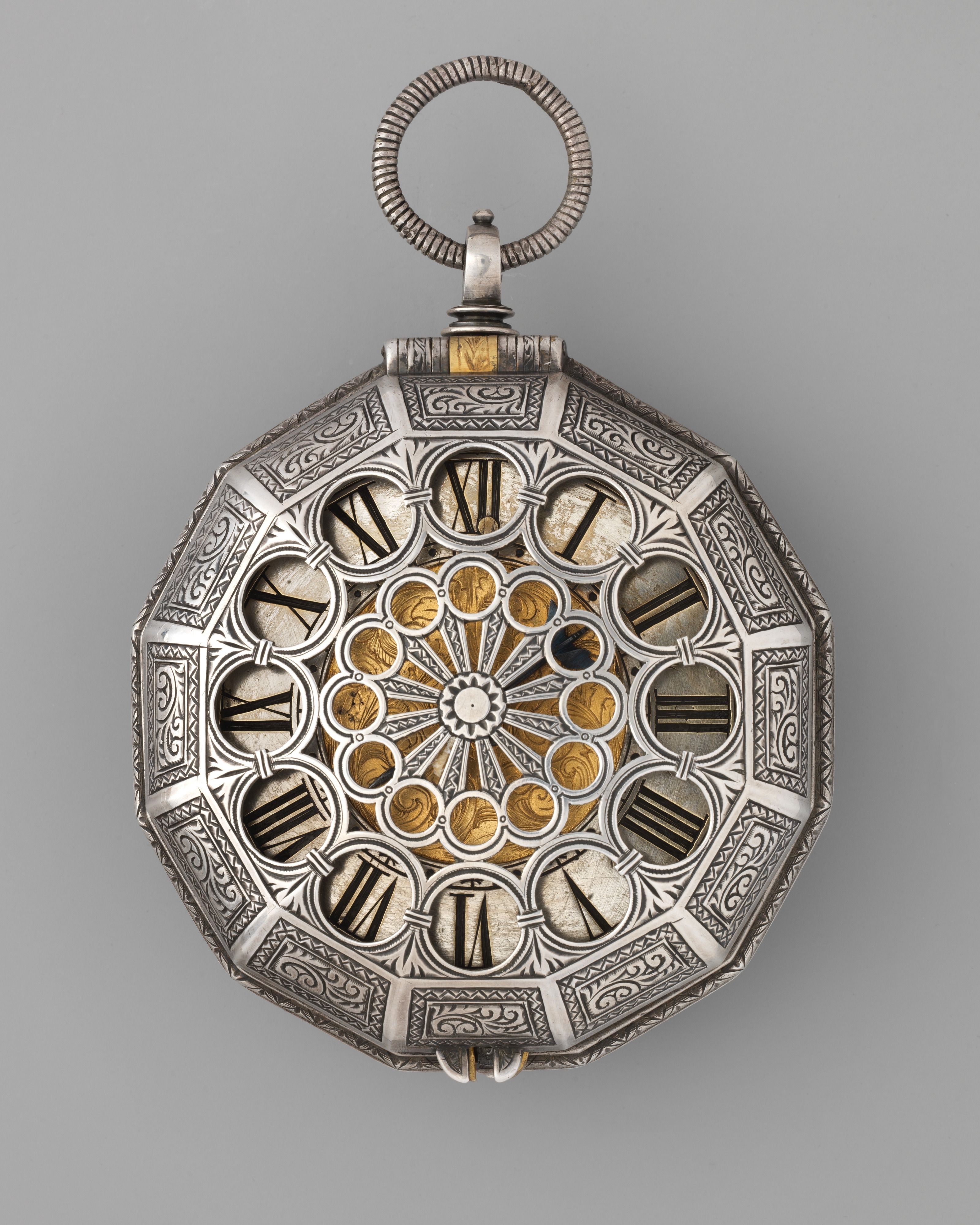 Engraved silver pocket watch with skeleton dial