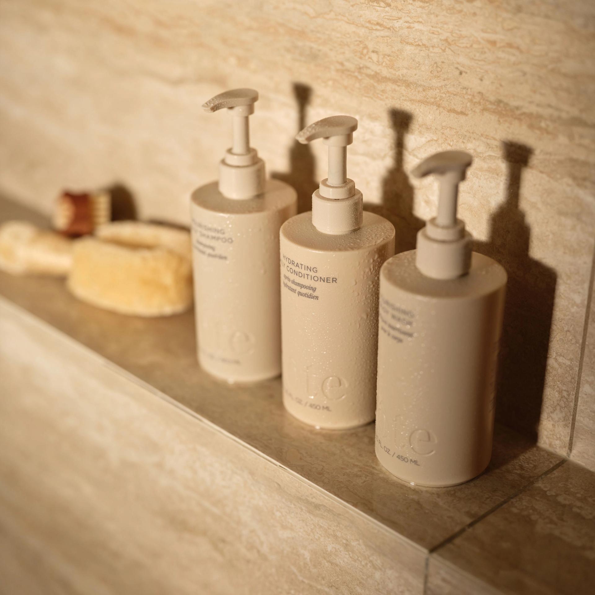 Cote Shampoo, Conditioner, Body Wash in the shower.