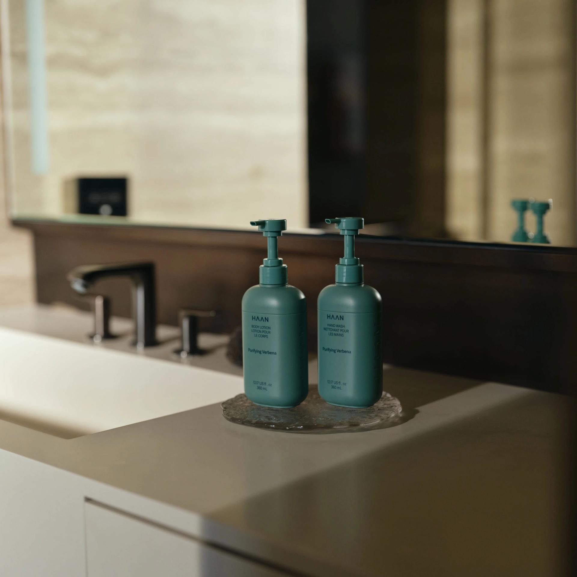 Haan Hand Wash and Body Lotion by the vanity side.
