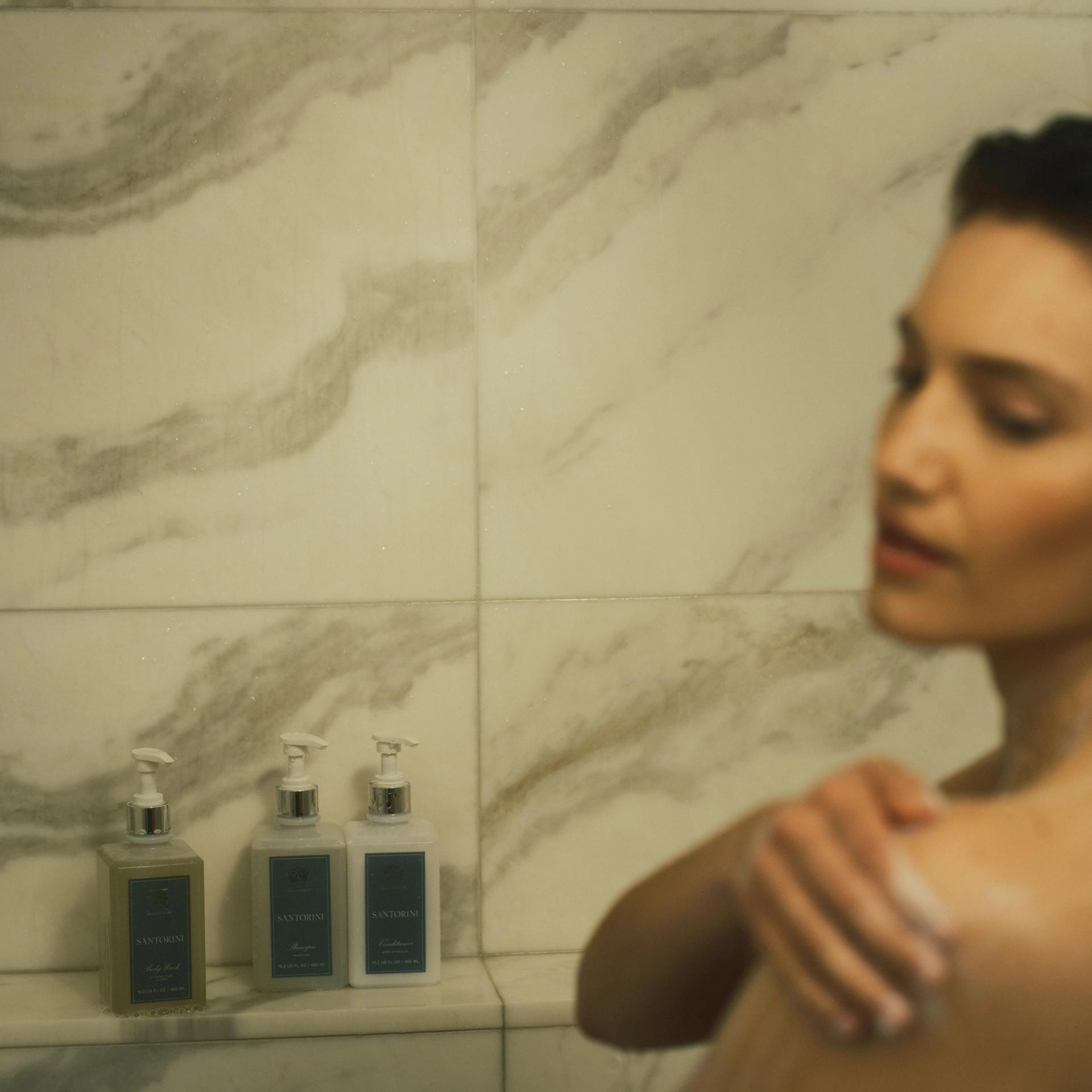 Antica Farmacista Shampoo, Conditioner and Body Wash in the shower with girl