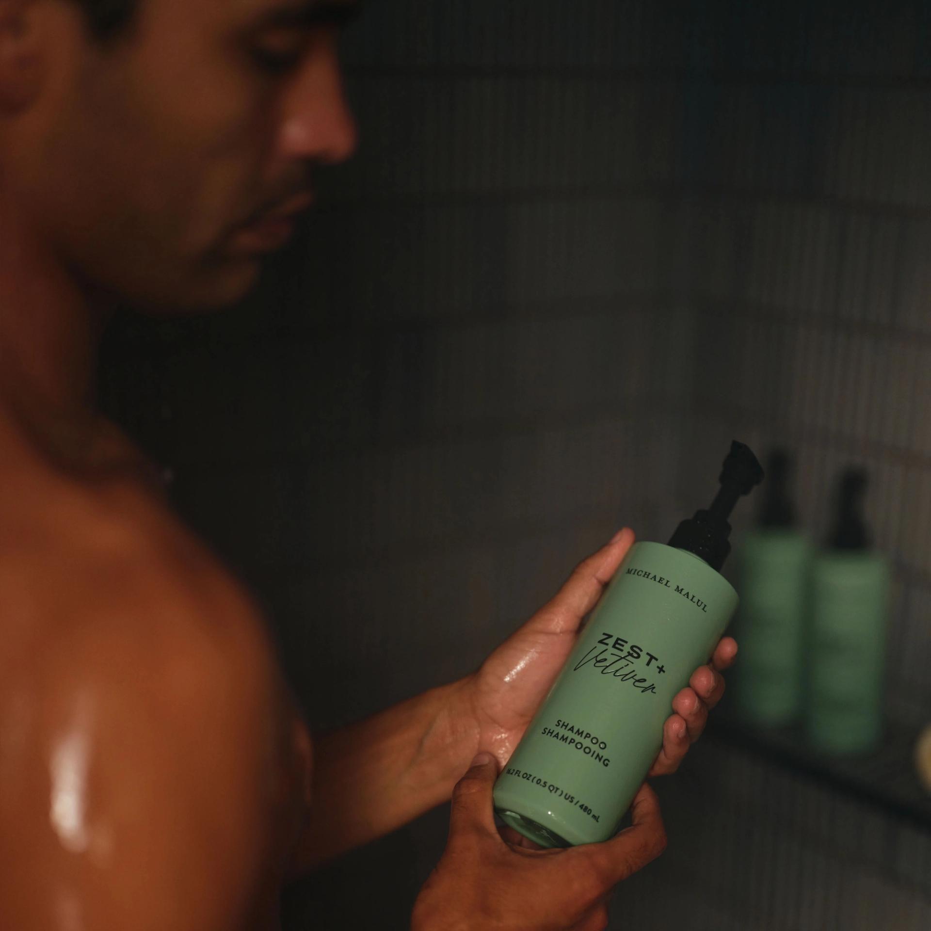 Michael Malul Shampoo 480ml dispensers in the shower.