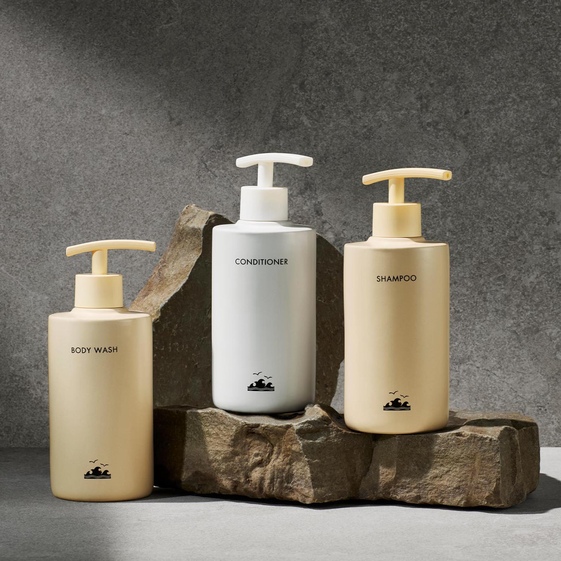 Four Seasons Surf Club Bespoke Shampoo, Conditioner and Body Wash bottles