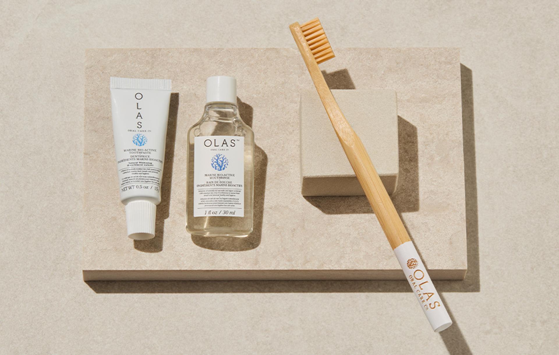 Olas mouthwash, toothpaste, and toothbrush displayed on counter