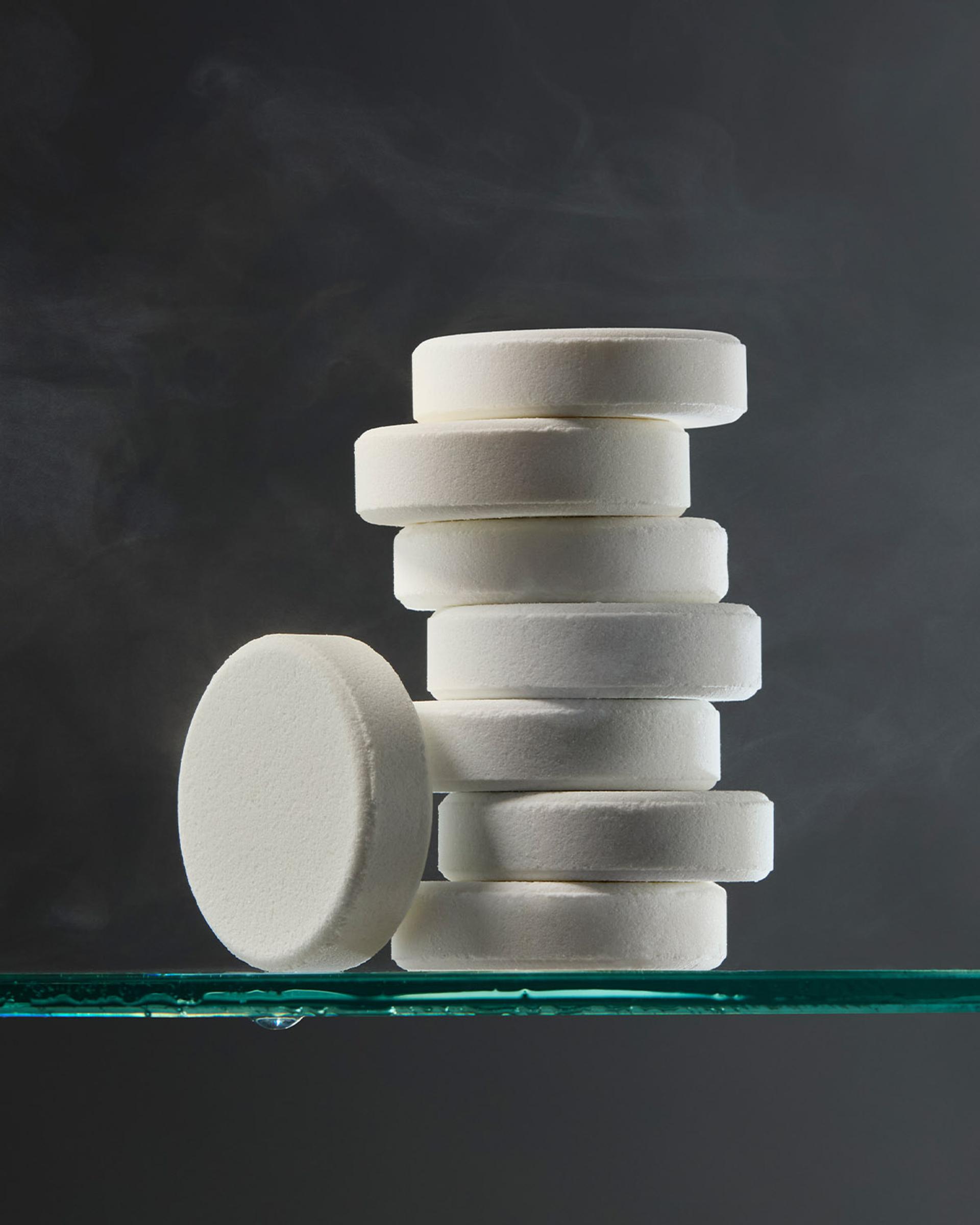 Crabtree & Evelyn Shower Steamer pucks stacked on shelf