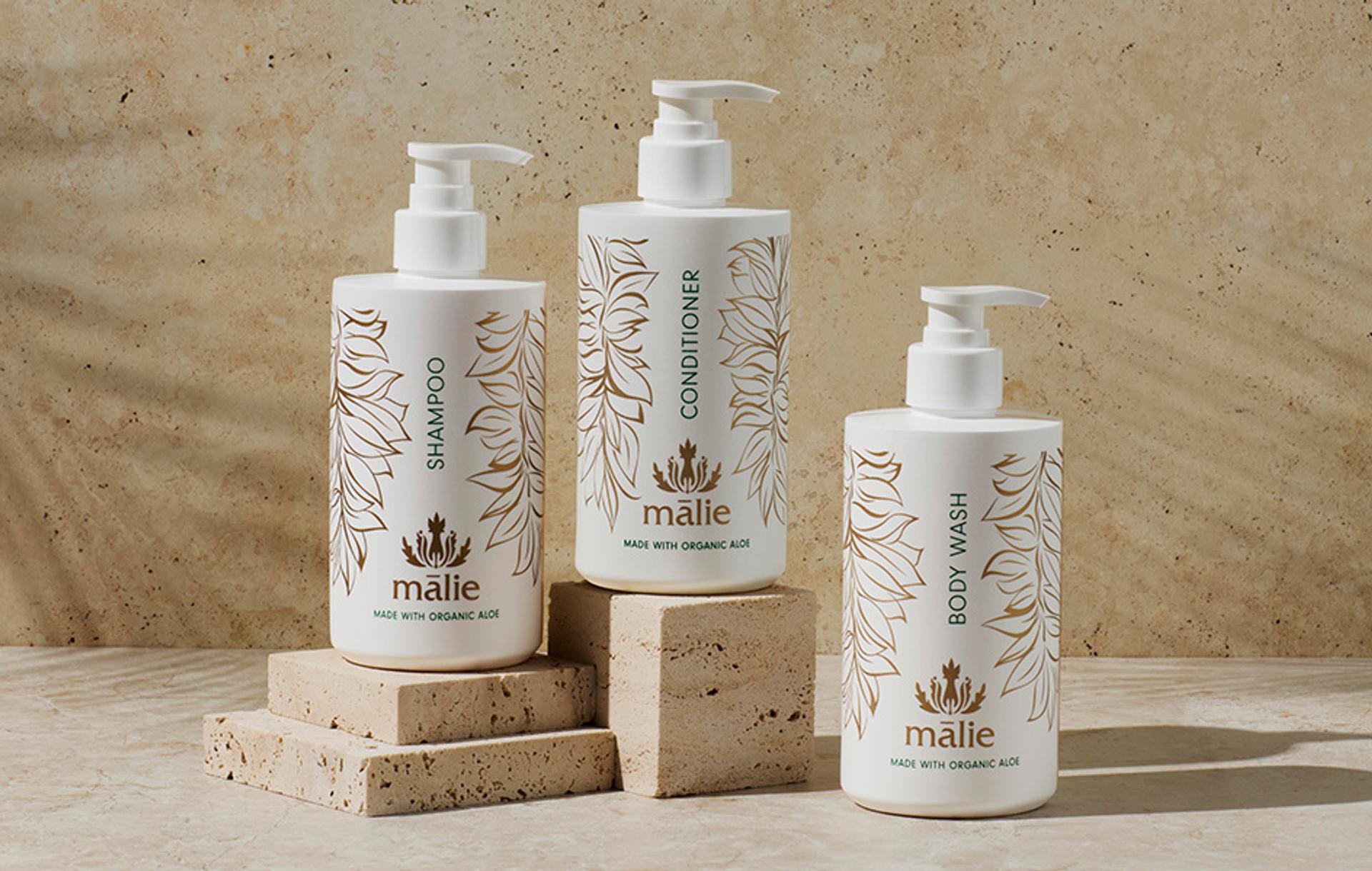 Malie Koke'e Shampoo, Conditioner and Body Wash dispensers on counter