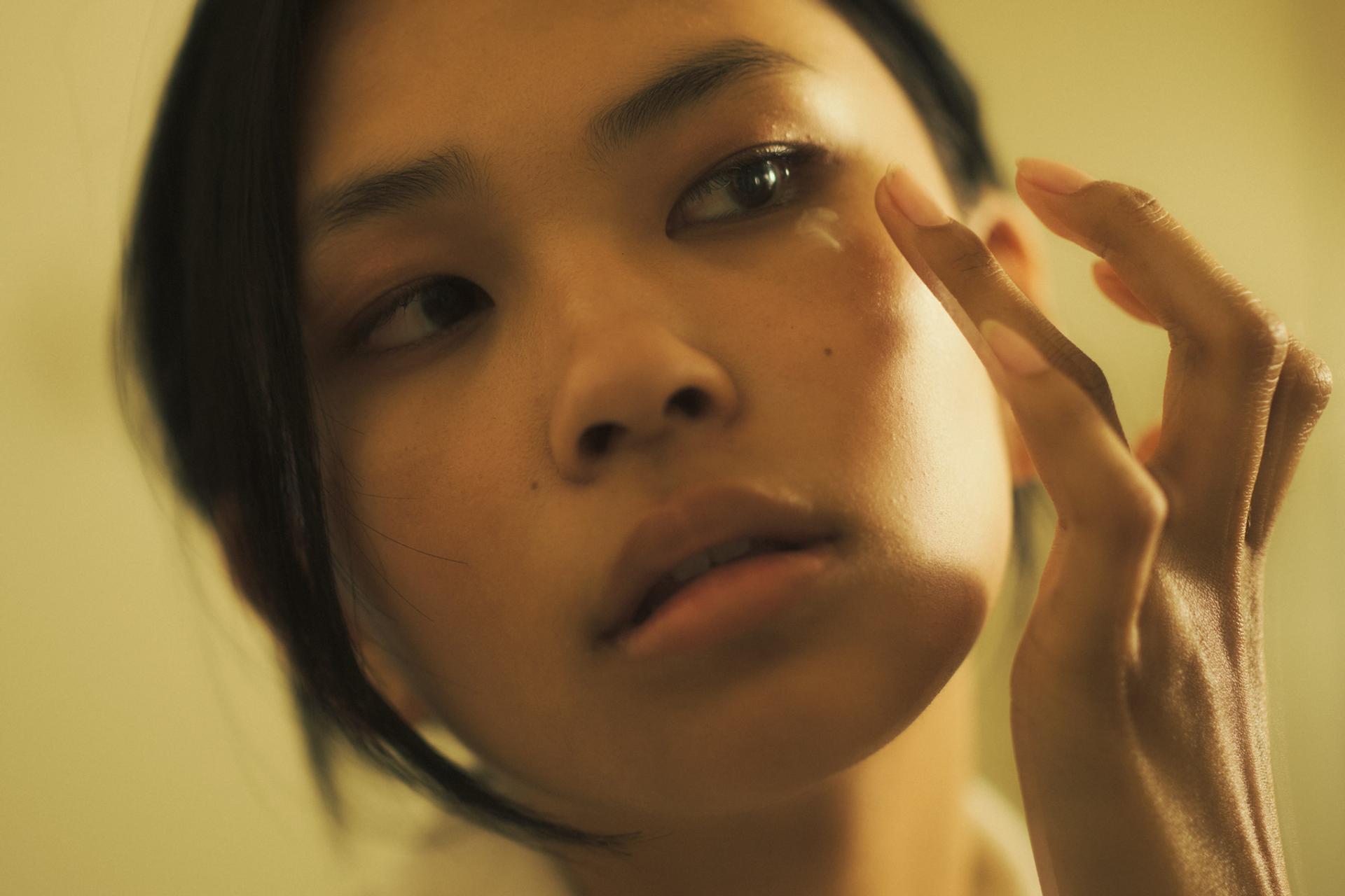 Girl Applying Eye Cream