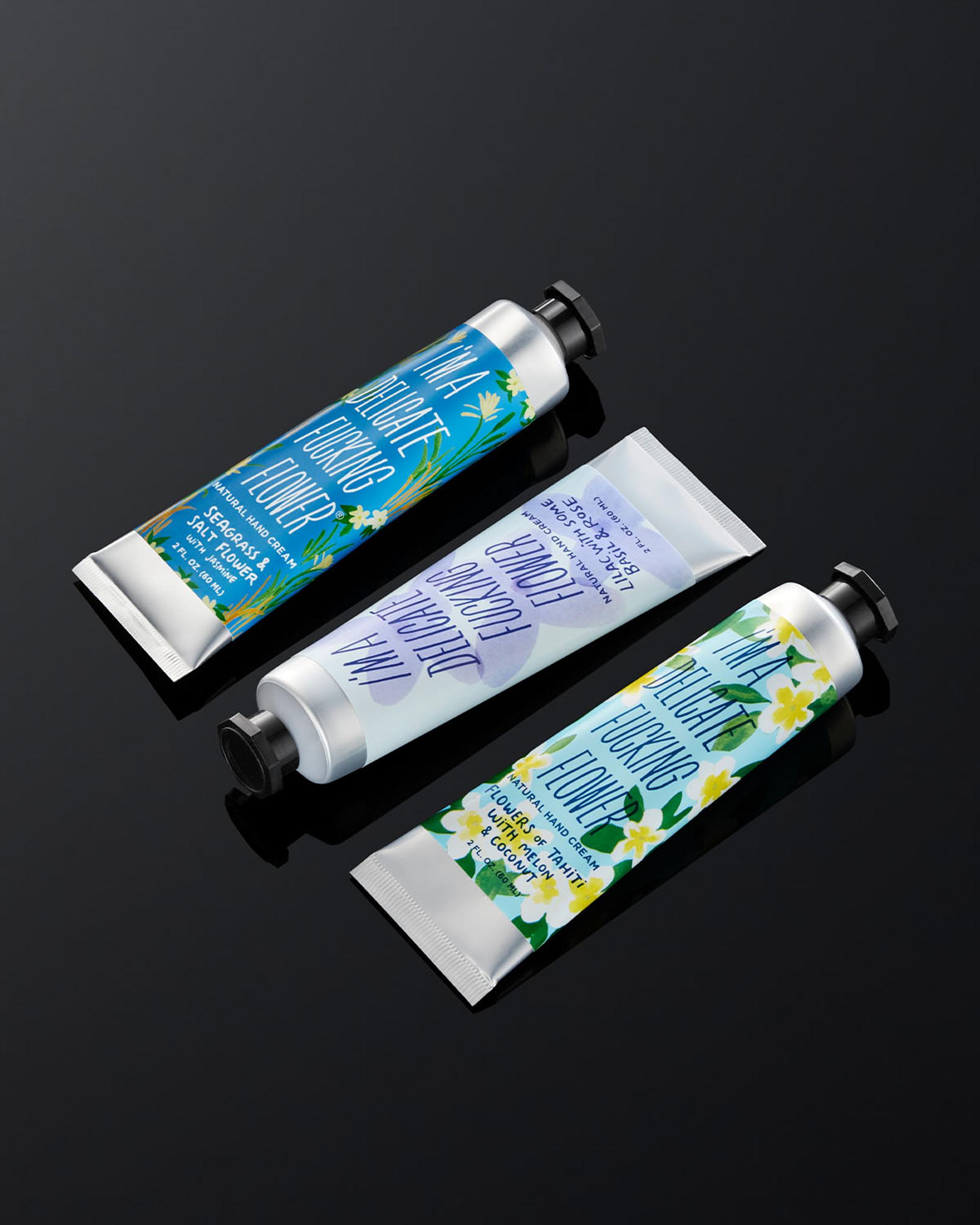 Three Blue Q tubes of I'm A Delicate Fucking Flower Hand Cream