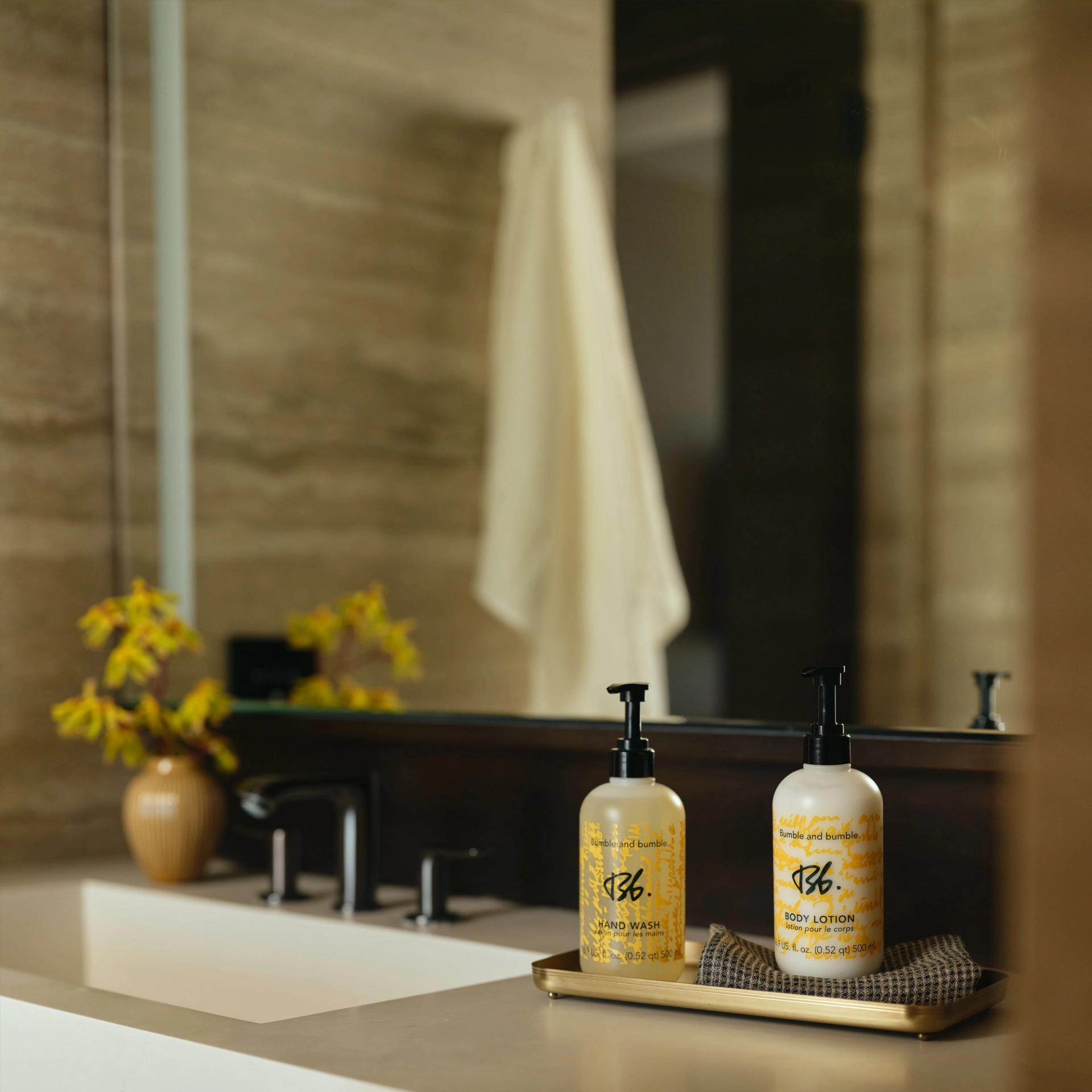 Bumble&bumble Hand Wash and Body Lotion 500ml on the vanity side.