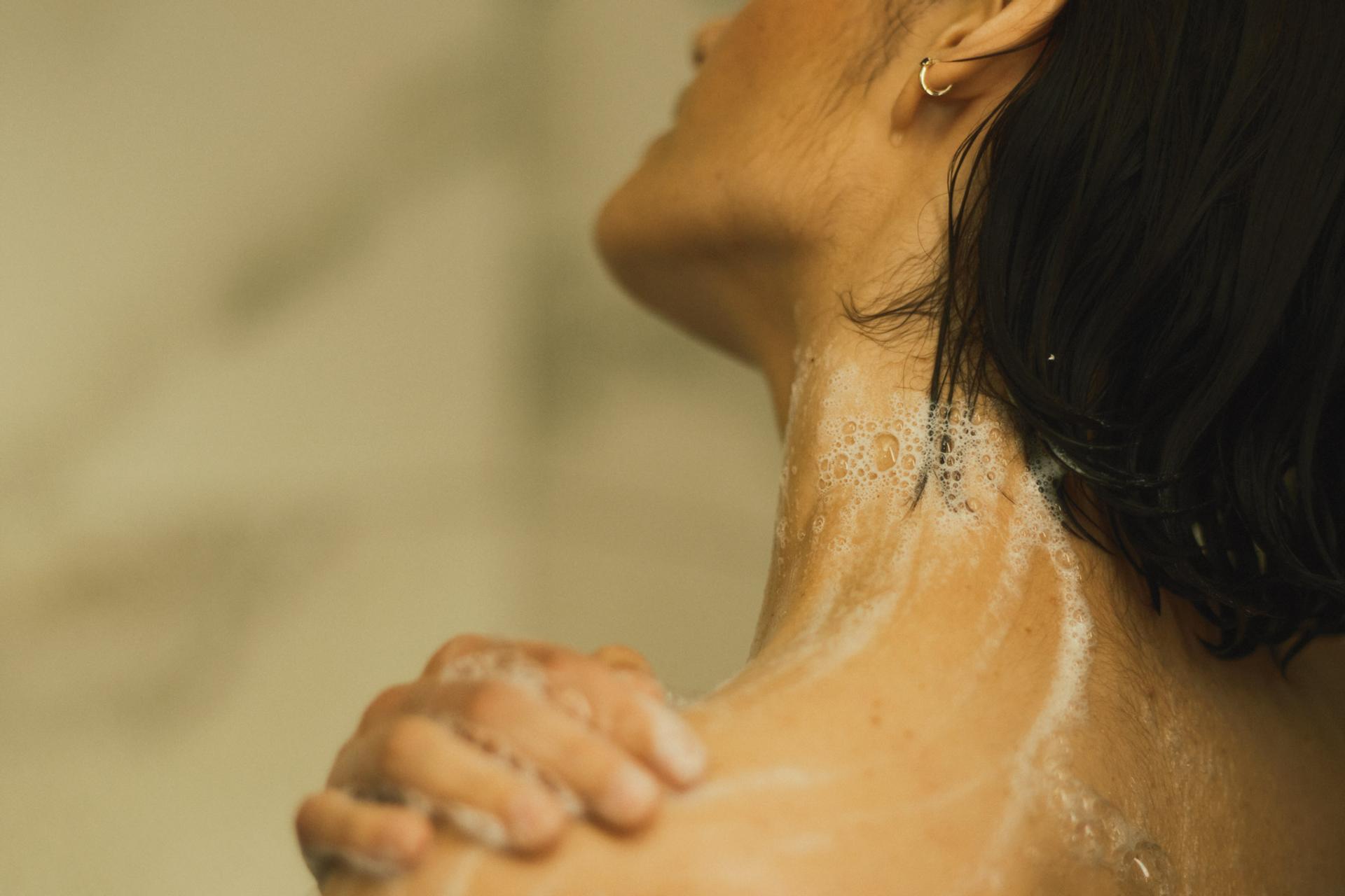 Girl in shower lathering