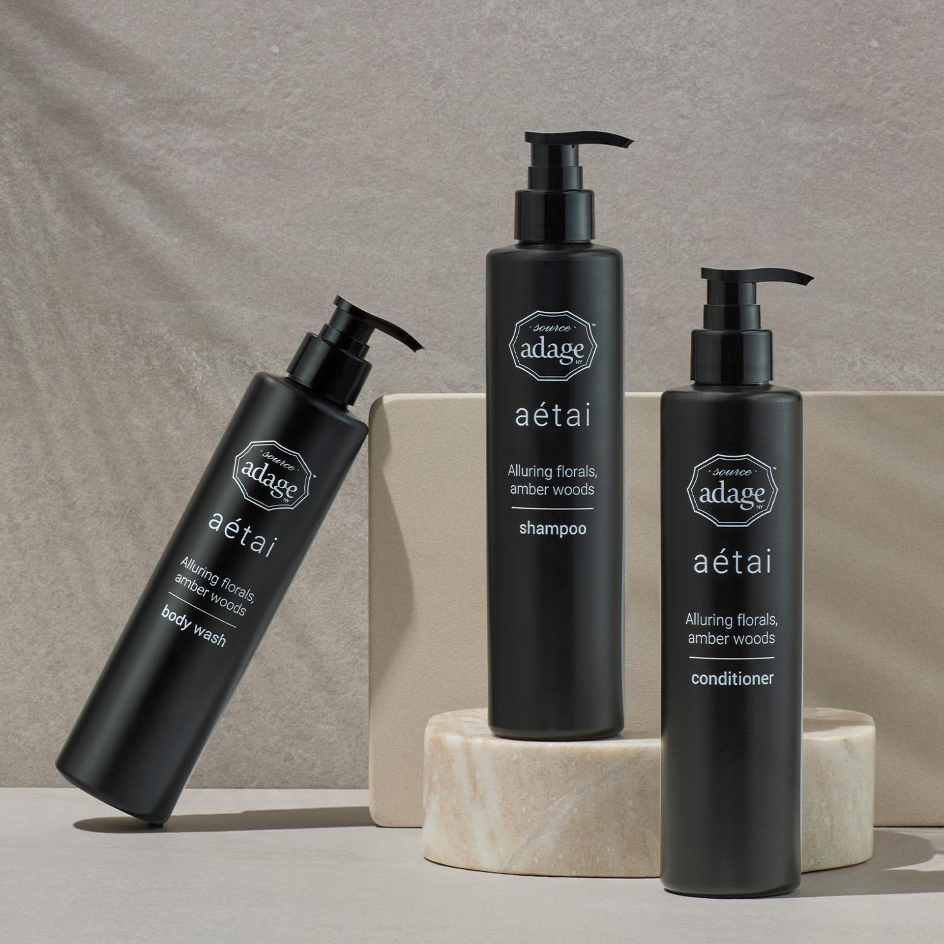 Source Adage Aetai Shampoo, Conditioner, and Body Wash dispensers on bathroom vanity