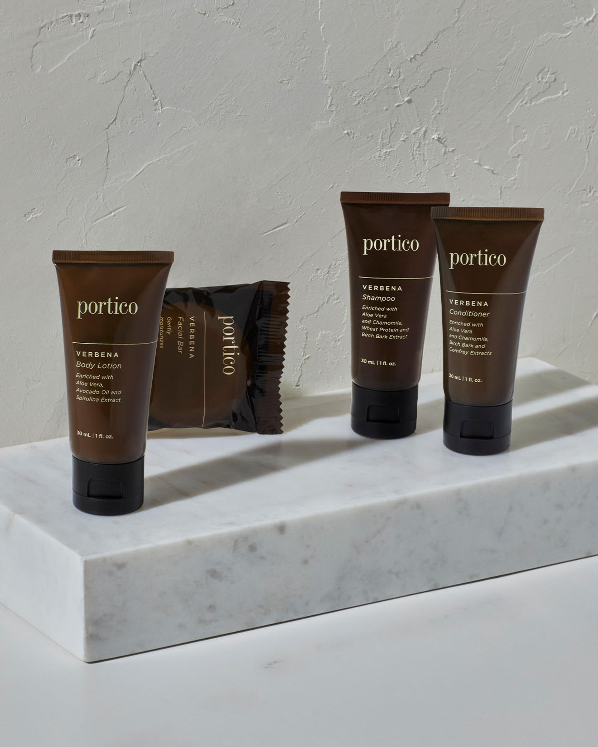 Portico Verbena single-use amenity collection on marble top