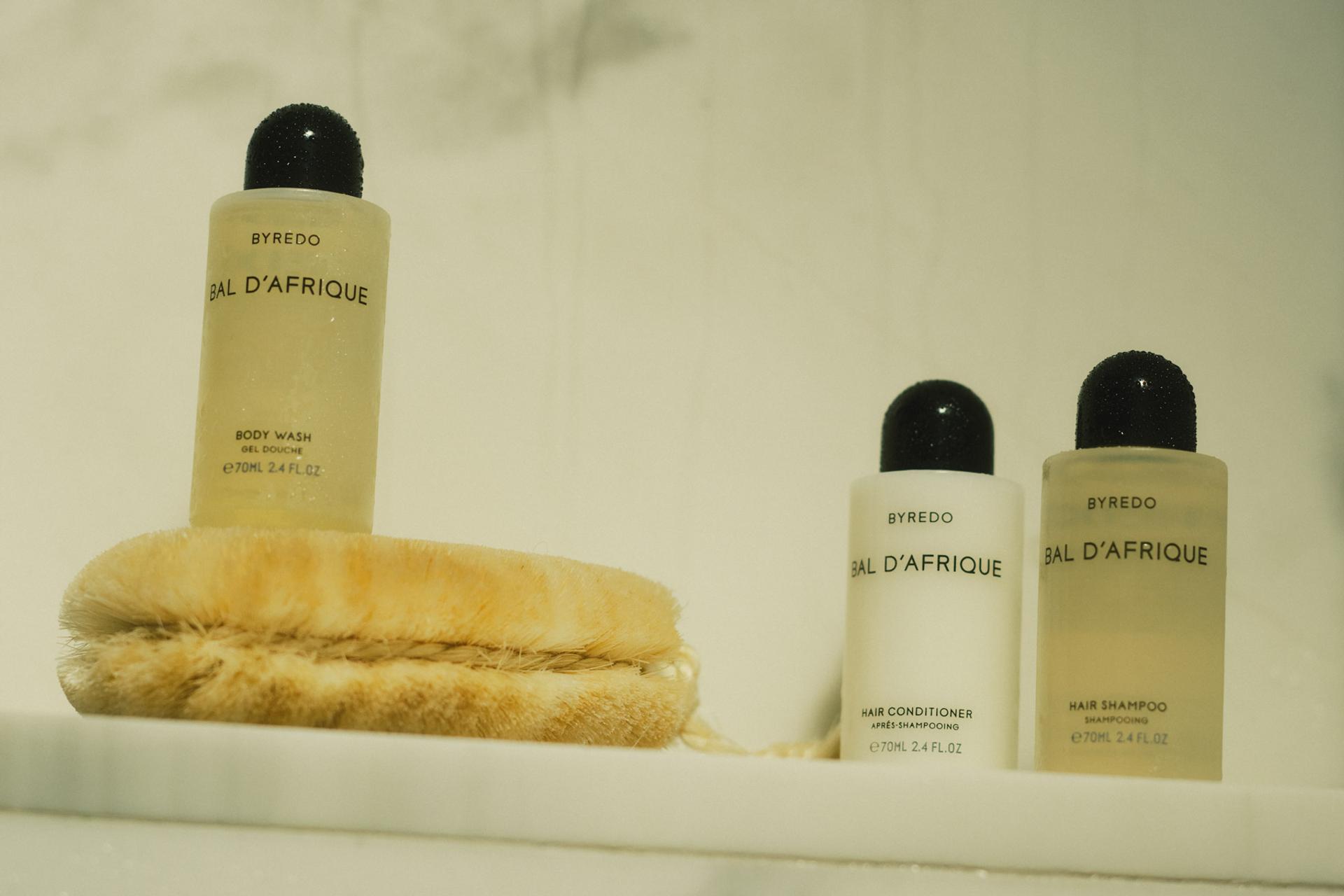 Byredo Bal d'Afrique Small Format Body Wash, Hair Shampoo and Conditioner on shower shelf