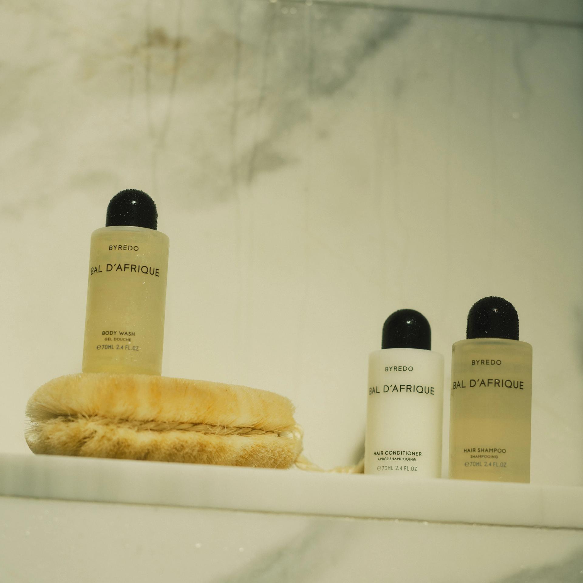 Byredo Bal d'Afrique Small Format Body Wash, Hair Shampoo and Conditioner on shower shelf
